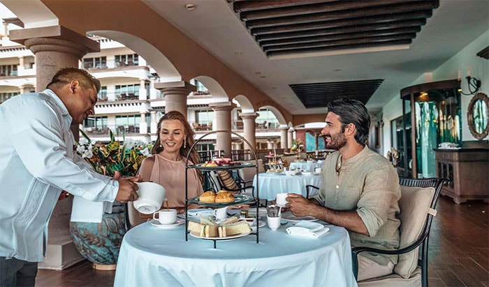 Couple drinking wine at restaurant in All Inclusive Resort Riviera Maya