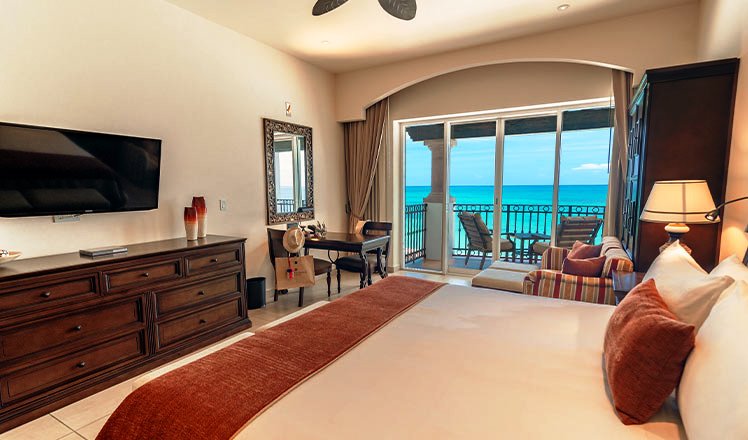 Junior Suite King, luxury room with a king size bed and ocean view balcony
